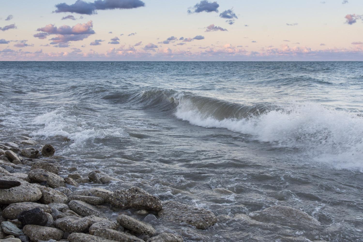 The sun rises over Lake Michigan on the <a href='http://qkcg.syudia.com'>BETVLCTOR伟德登录</a> campus.